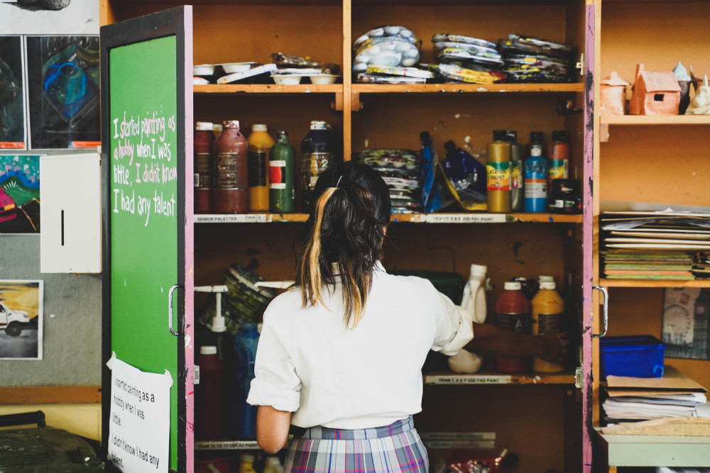 Girl In Art Supplies Cupboard