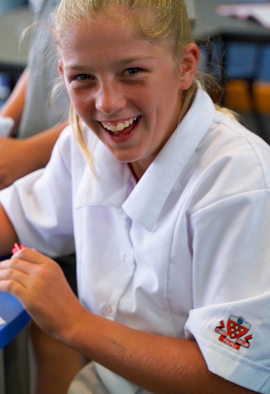 Stduent_Girl_Smiling_Whilst_Drawing