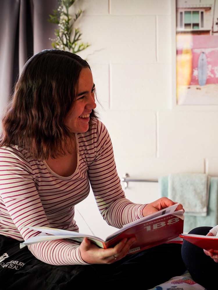 Two_Girls_Studying_On_Bed_cropped_750x1000