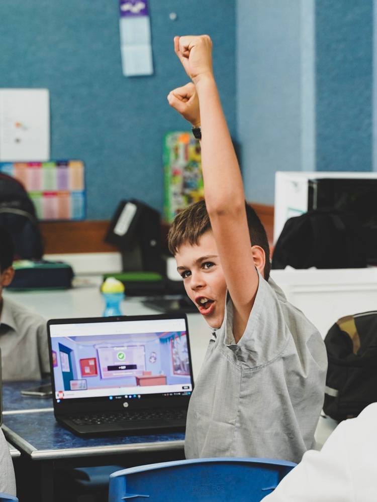 Boy_Cheering_In_School