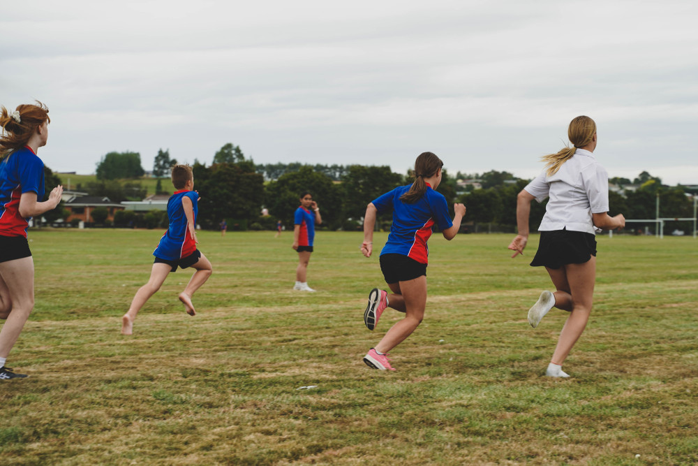 Students Sprinting On Field